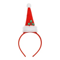 Fascia per capelli a cappello di Babbo Natale con agrifoglio